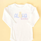 White long-sleeve shirt with 'Aloha beaches' text on a yellow background