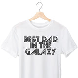 White t-shirt with 'Best Dad in the Galaxy' text on a hanger against a white background