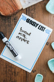 Grocery List SVG caption on a white board with a marker on a wooden surface