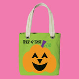 Green Halloween tote bag with orange pumpkin design and 'Trick or Treat' text on a pink background